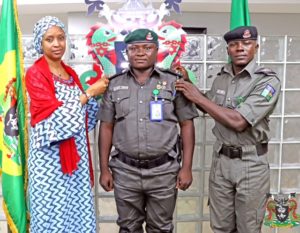 L-R: The Managing Director, Nigerian Ports Authority (NPA), Hadiza Bala Usman decorating newly promoted Inspector Kabiru Jibrin, one of the security details to the MD. To the right is Inspector Olabode Ayebidun, another security aid during the ceremony at the NPA Corporate Headquarters in Lagos.