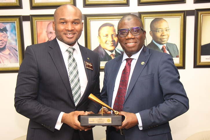 L – R shows Olumide Bolumole, Head, Listings Business Division, The Nigerian Stock Exchange (NSE) presenting a replica of the Closing Gong to Ganiyu Musa, Group Managing Director/Chief Executive Officer, Cornerstone Insurance Plc during the company’s courtesy visit to The Exchange, Lagos on Wednesday, 15 January 2020.