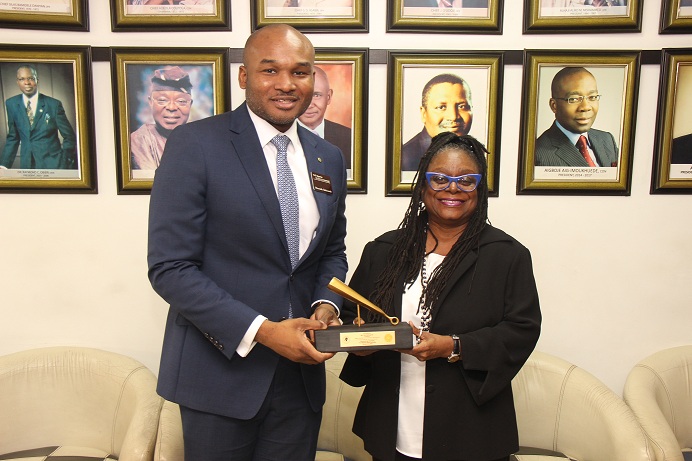 L – R shows Mr. Olumide Bolumole, Head, Listings Business Division, The Nigerian Stock Exchange (NSE) presenting a replica of the Closing Gong to Mrs. Toki Mabogunje, President, Lagos Chamber of Commerce and Industry (LCCI) during the association’s courtesy visit to The Exchange, Lagos on Tuesday, 21 January 2020.