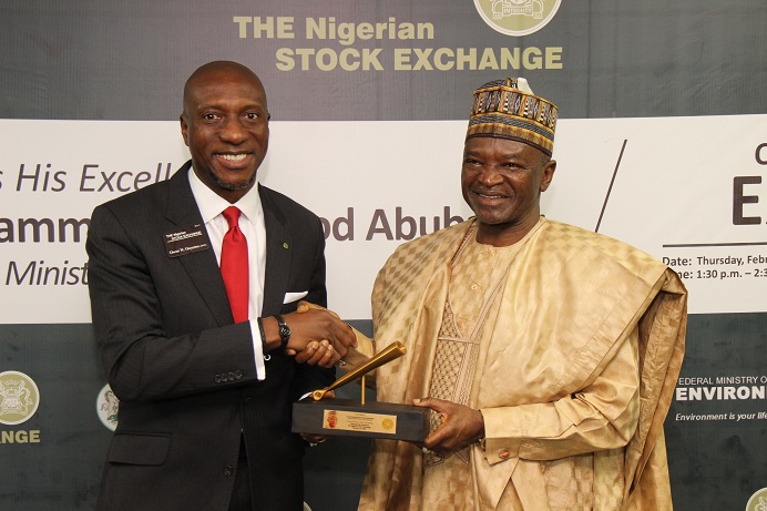 L – R shows Oscar N. Onyema, OON, Chief Executive Officer, The Nigerian Stock Exchange (NSE) presenting a replica of the closing gong to Honourable Minister of Environment, Dr. Mohammad Mahmood Abubakar during a courtesy visit to The Exchange today in Lagos.