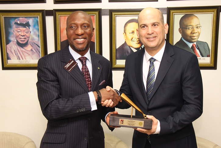  L – R shows Mr. Oscar N. Onyema, OON, Chief Executive Officer, The Nigerian Stock Exchange (NSE) presenting a replica of the closing gong to Mr. Bruno Zambrano, Finance Director, International Breweries Plc during a Closing Gong Ceremony to commemorate the successful listing of the N165billion rights issue at the Exchange today in Lagos.