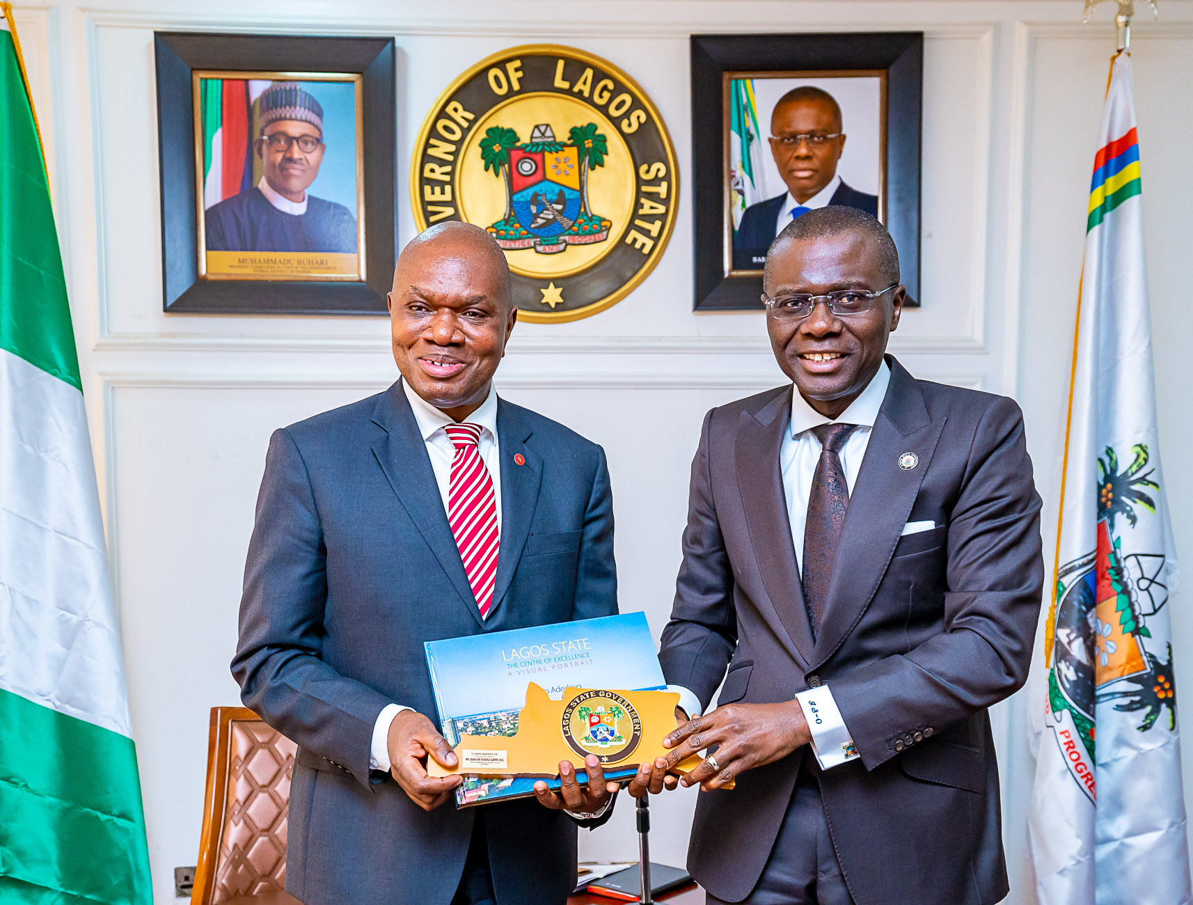 Lagos State Governor, Mr. Babajide Sanwo-Olu (right), presents souvenir to the United Nations Industrial Development Organization (UNIDO) Representative to ECOWAS and Regional Director, Nigeria Regional Office Hub, Mr. Jean Bakole during a courtesy visit to the Governor at Lagos House, Alausa, Ikeja, on Monday, February 3, 2020.
