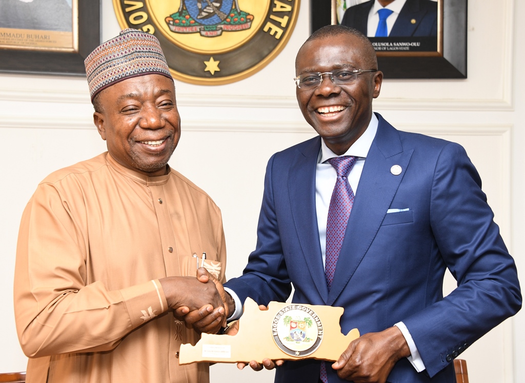 Lagos State Governor, Mr. Babajide Sanwo-Olu (right), presents a plaque to the Chairman, Senate Committee on Works, Senator Mohammad Aliero, during a courtesy call by the Senate Committee at Lagos House, Alausa, Ikeja on Wednesday, February 12, 2020.