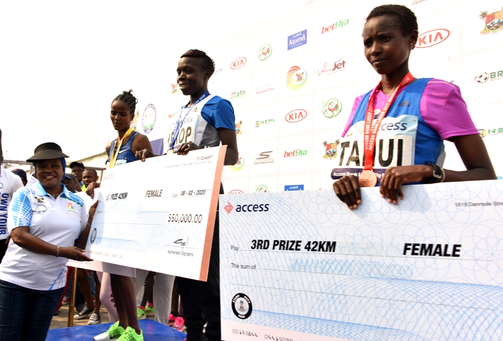 L-R: Secretary to the State Government, Mrs. Folashade Jaji with the winners of the female category, 2nd Prize - Kebene Chala urisa from Ethopia; 1st Prize -Cherop Sharon Jemutai and 3rd Prize - Rodah Jepkorir Tanui, both from Kenya during the Lagos City Marathon, at Eko Atlantic City, Victoria Island, on Saturday, February 8, 2020.