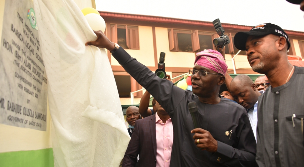 Lagos State Governor, Mr. Babajide Sanwo-Olu, unveiling the plaque to commission the newly built CMS Primary Health Centre, Ilaje - Bariga, while the Chairman, of Bariga LCDA, Hon. Alabi Kolade (right), watches, on Friday, February 14, 2020.