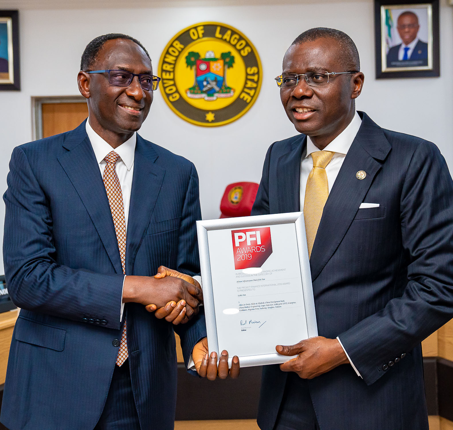 L-R: Chairman, Lekki Port, Mr. Abiodun Dabiri, presents the Project Finance International (PFI) Award of African Infrastructure Deal of the Year, won by Lekki Port to Lagos State Governor, Mr. Babajide Sanwo-Olu, at Lagos House, Alausa, Ikeja, on Tuesday, February 18, 2020.