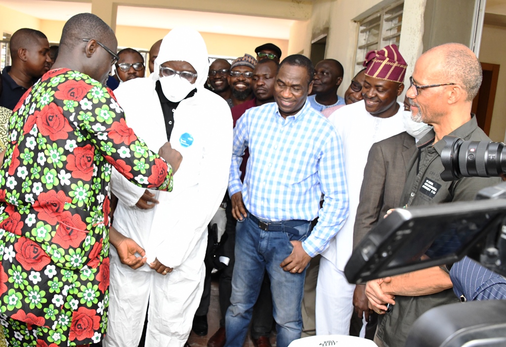 L-R: Medical Director, Mainland Hospital, Dr. Abimbola Bowale assisting Lagos State Governor, Mr. Babajide Sanwo-Olu into a protection kit while his deputy, Dr. Obafemi Hamzat; Permanent Secretary, Lagos State Primary Health Care Board (LSPHCB), Dr. Olugbemiga Aina and Commissioner for Health, Prof. Akin Abayomi watches on during an inspection visit to the Emergency Operations Centre and Biosecurity Unit at Mainland Infectious Disease Hospital Yaba, on Sunday, March 1, 2020.