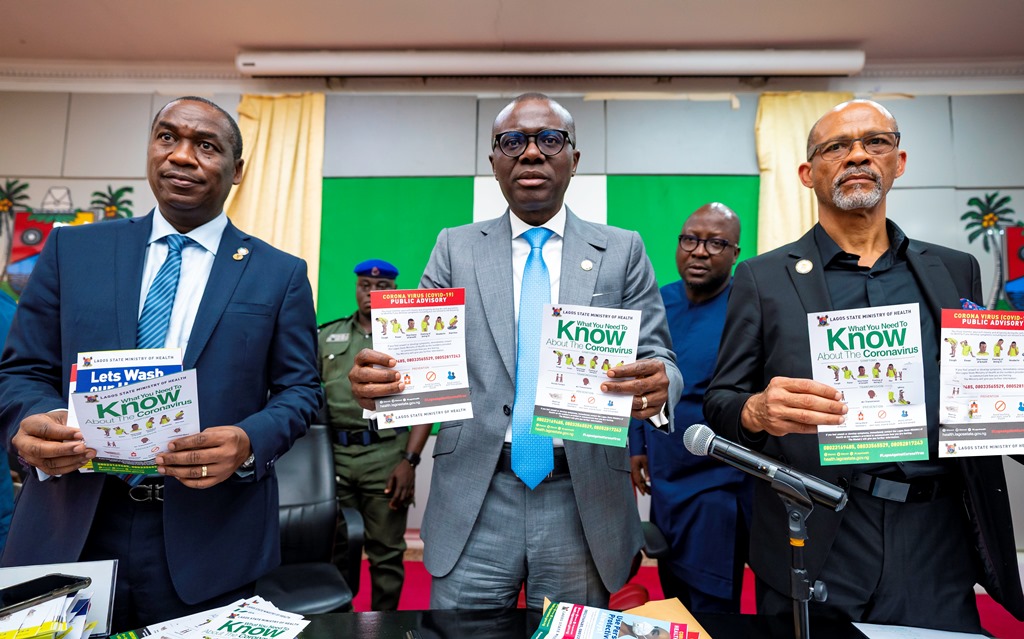 L-R: Lagos Deputy Governor, Dr. Obafemi Hamzat; Governor Babajide Sanwo-Olu and Commissioner for Health, Prof. Akin Abayomi displaying Coronavirus sensitisation materials during an advocacy meeting with Local Council Chairmen and other stakeholders at Lagos House, Alausa, on Monday, March 2, 2020.