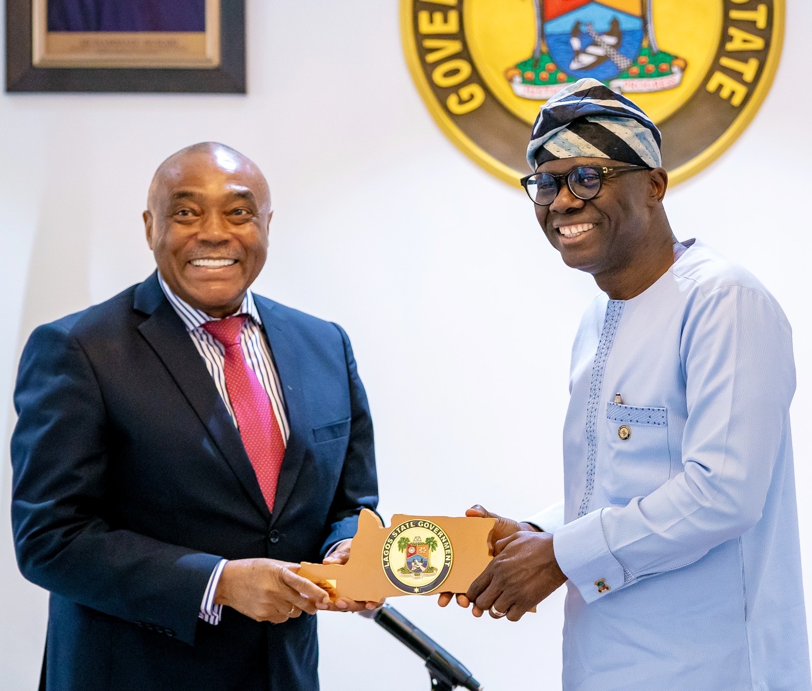 L-R: Independent Non-Executive Director of Dangote Cement Plc, Mr. Emmanuel Ikazoboh, receiving a plaque from Lagos State Governor, Mr. Babajide Sanwo-Olu, during a courtesy visit to the Governor by the executive management of Dangote Cement Plc at Lagos House, Marina, on Wednesday, March 18, 2020.