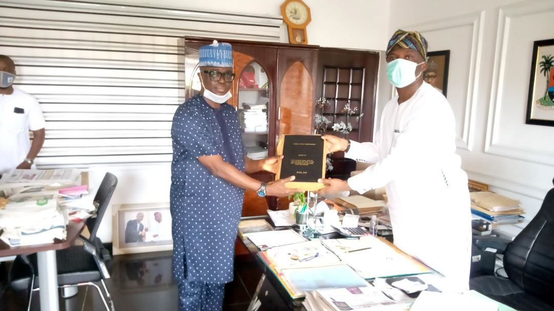 Chairman, Lagos State Polytechnic (LASPOTECH) Visitation Panel, Barr. Adelowo Afolayan (left) presenting the Visitation Panel report to Special Adviser to the Governor on Education, Mr. Tokunbo Wahab (right) on Thursday, June 25, 2020.
