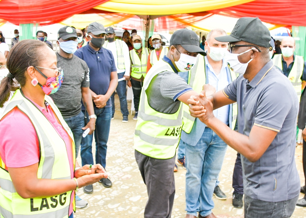 Lagos State Governor, Mr. Babajide Sanwo-Olu (right), exchanging greetings with his Deputy, Dr. Obafemi Hamzat (second left), while Special Adviser to the Governor on Works and Infrastructure, Mrs. Aramide Adeyoye (left) and representative of Hitech Construction Company, Mr. Danny Abboud (second right), watch on during the flag-off of Lekki Regional Road as part of activities to commemorate the First Year in Office of the Sanwo-Olu administration, at Eti-Osa Local Government, on Saturday, May 30, 2020.