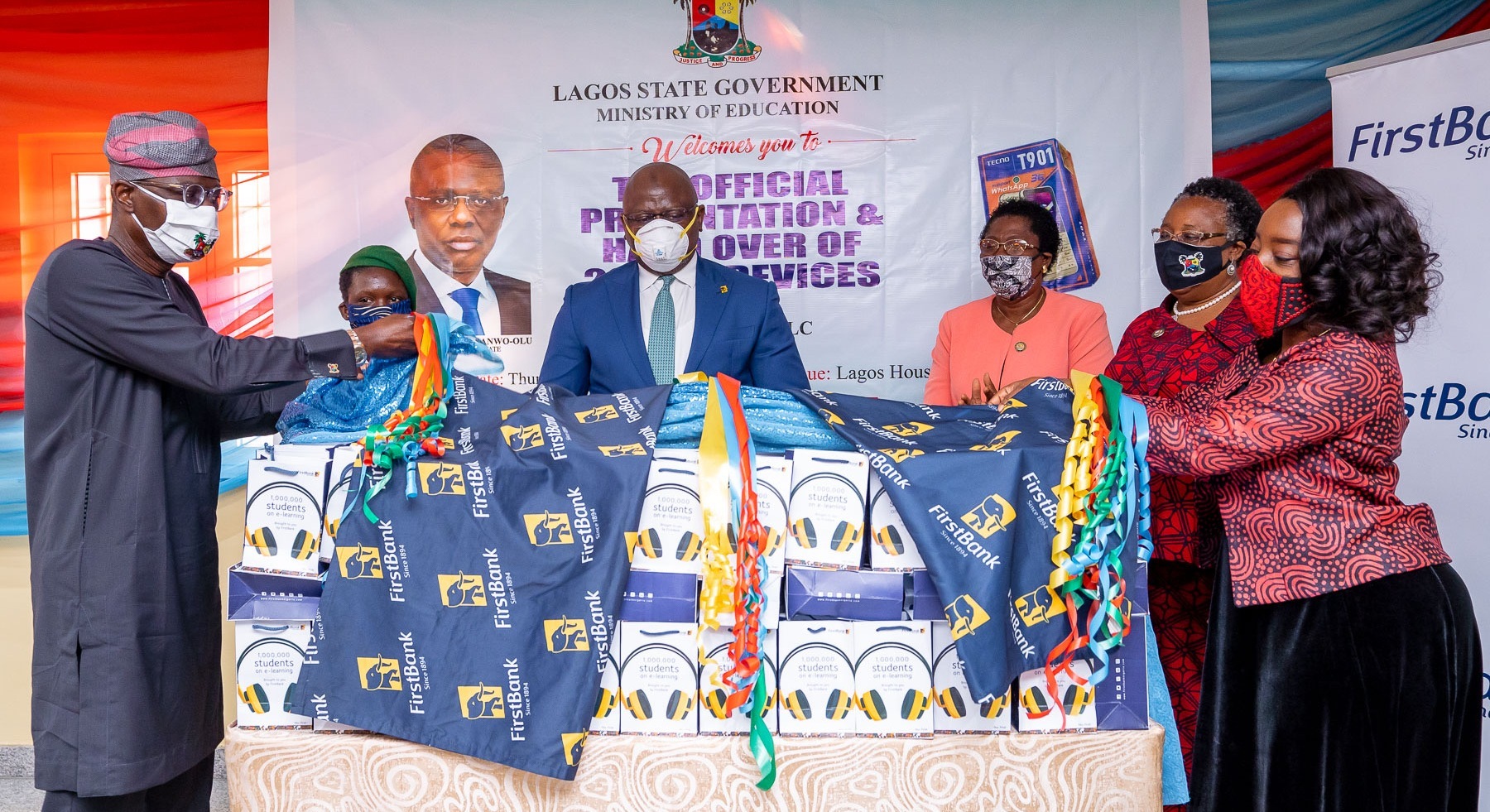 L-R: Lagos State Governor, Mr. Babajide Sanwo-Olu; beneficiary, Miss Sherifat Umar of Elegbata Senior High school, Lagos Island; Managing Director/CEO, First Bank PLC, Dr. Adeola Adeduntan; Permanent Secretary, Ministry of Education; Mrs. Abosede Adelaja; Commissioner for Education; Mrs. Folasade Adefisayo and wife of the Governor, Dr. Ibijoke, during the unveiling of the 20,000 E-Learning devices for Lagos State Schools, presented by First Bank at the Lagos House, Marina, on Thursday, June 11, 2020.