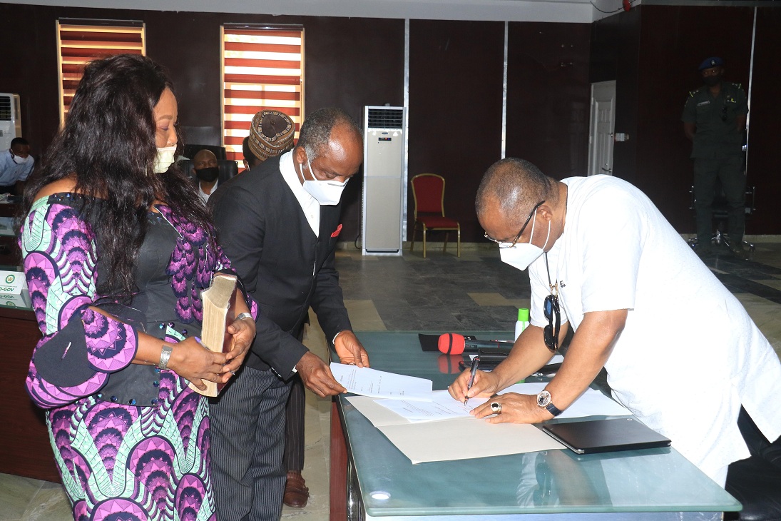 Governor Uzodimma endorsing the Oath of Office for the Chairman of Imo State Independent Electoral Commission (ISIEC), Mrs. Onyeka Pauline Ugochi.