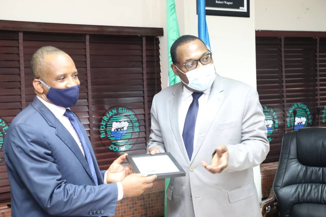 L-R: Director General of Nigerian Maritime Administration and Safety Agency, (NIMASA ); Dr. Bashir Jamoh, receiving plaque from Executive Secretary of Nigerian Shippers Council (NSC) Barr Hassan Bello, during the Maiden Meeting of Heads of Government Parastatals in the Maritime Sector.