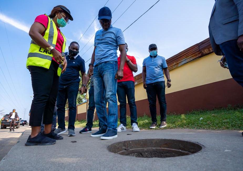 L-R: Special Adviser to the Governor on Works and Infrastructure, Engr. (Mrs) Aramide Adeyoye; Commissioner for Information and Strategy, Mr. Gbenga Omotoso and Lagos State Governor, Mr. Babajide Sanwo-Olu, during an inspection of manhole access points and illegal removal of its covers at Eric Moore in Surulere, at the weekend.