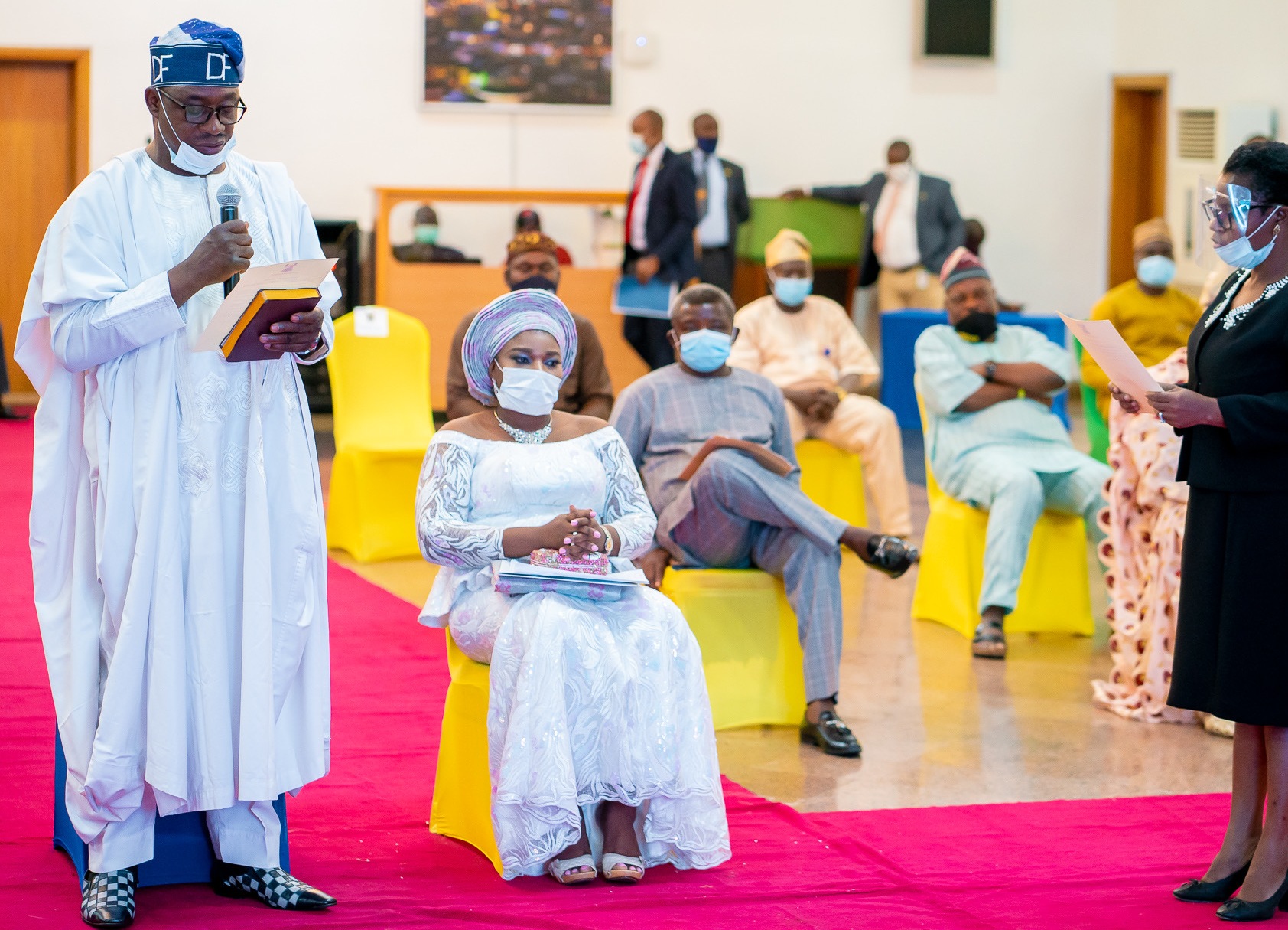 3844: New Chairman of Agbado-Oke Odo LCDA, Mr. David Famuyiwa (left), taking his Oath of Office, presided over by Lagos State Governor, Mr. Babajide Sanwo-Olu, at Lagos House, Alausa, Ikeja, on Tuesday, June 30, 2020. Seated by him is his wife, Abiodun.