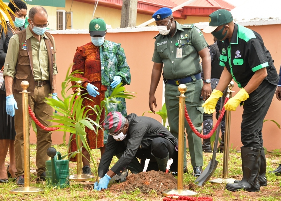 Lagos State Governor, Mr. Babajide Sanwo-Olu, performing the tree planting exercise during the annual Tree Planting Day at the Infectious Disease Hospital, Yaba, on Tuesday, July 14, 2020. With him from left: Commissioner for Health, Prof. Akin Abayomi; General Manager, Lagos State Parks and Gardens (LASPARK), Mrs. Aetoun Popoola and Commissioner for the Environment and Water Resources, Mr. Tunji Bello.