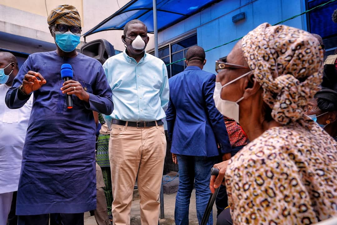 L-R: Lagos State Governor, Mr. Babajide Sanwo-Olu talking to one of the affected residents, Mrs. Johnson during his visit to the scene of helicopter crash at Opebi area of Ikeja, on Saturday, August 29, 2020. With him is Commissioner for Special Duties and Inter-governmental Relations, Mr. Tayo Bamgbose-Martins.