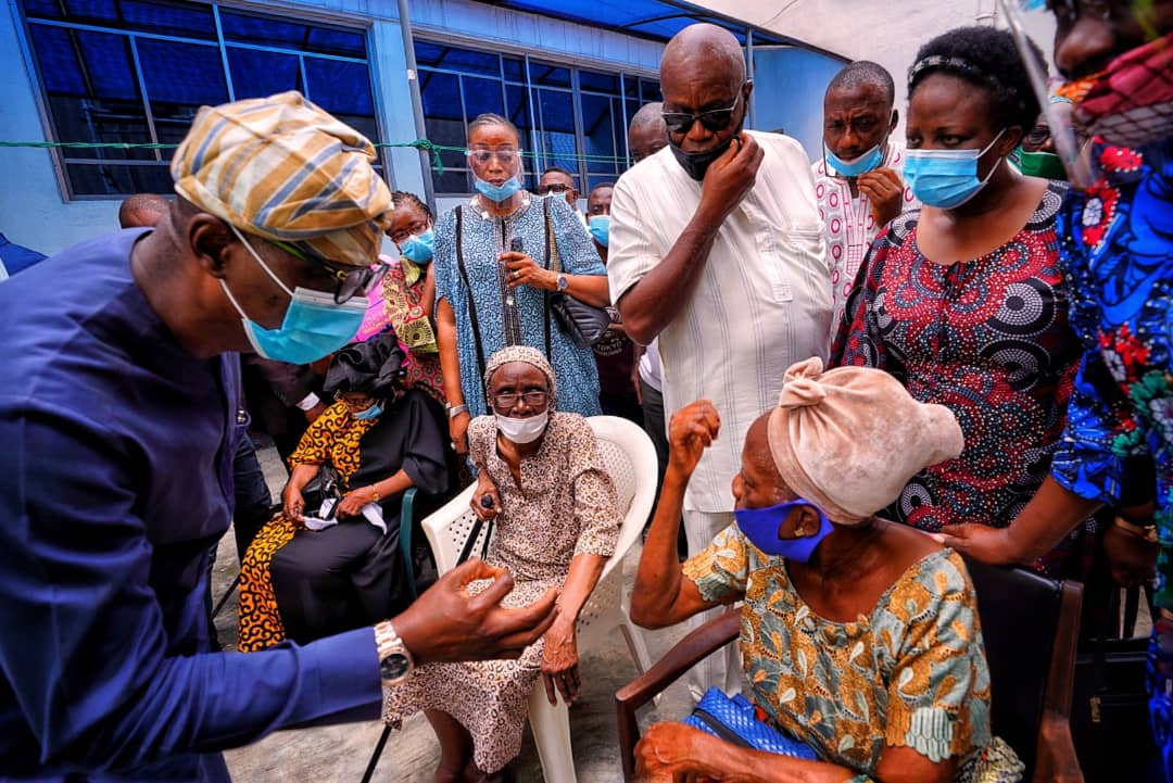 L-R: Lagos State Governor, Mr. Babajide Sanwo-Olu, sympathizing with Mrs. Johnson and Mrs. Oluwole, affected residents of the helicopter crash, during his visit to the accident scene at Opebi area of Ikeja, on Saturday, August 29, 2020.
