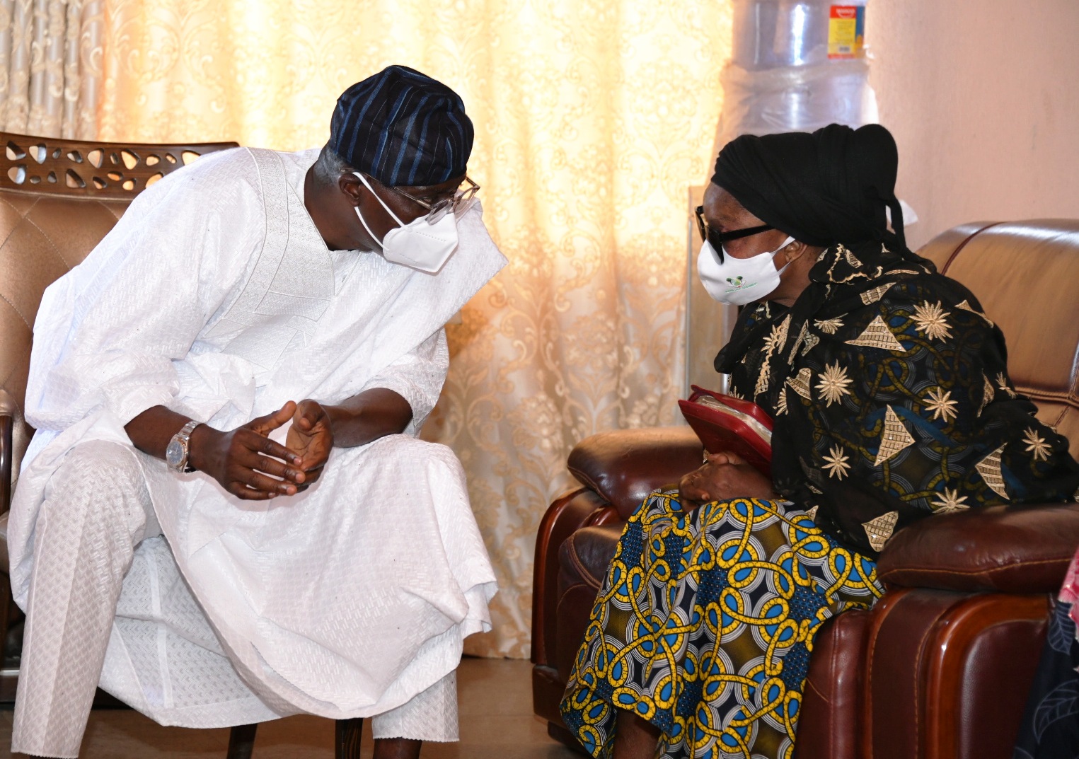  Lagos State Governor, Mr Babajide Sanwo-Olu (left), condoling with wife of the deceased, Mrs. Jumoke Rasak during a condolence visit to the family of late Chief Lanre Razak, on Sunday, August 16, 2020.
