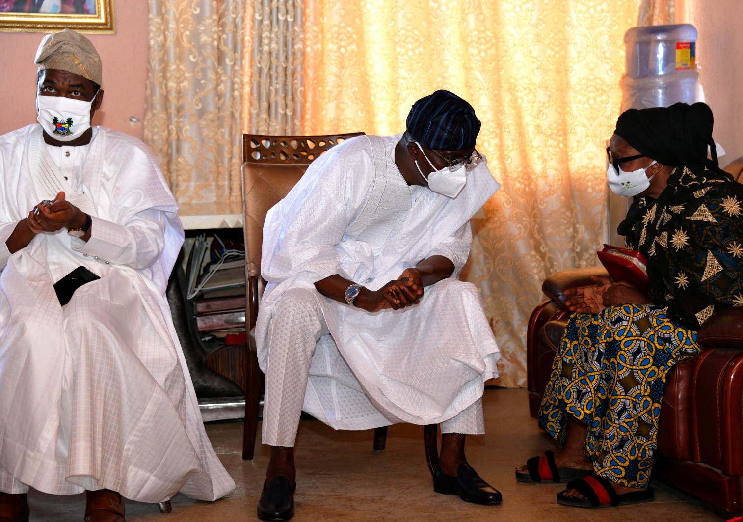L-R: Lagos State Deputy Governor, Dr. Obafemi Hamzat; Governor Babajide Sanwo-Olu and wife of the deceased, Mrs. Jumoke Rasak, during a condolence visit to the family of late Chief Lanre Razak, on Sunday, August 16, 2020.