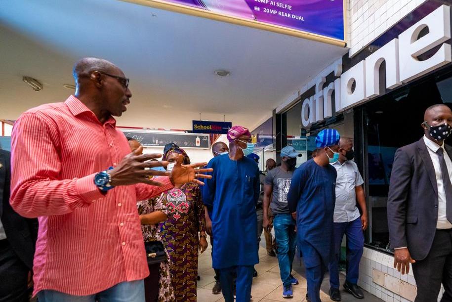 Lagos State Governor, Mr. Babajide Sanwo-Olu (second right) and his Deputy, Dr. Obafemi Hamzat (right), being conducted round by a business owner at Adeniran Ogunsanya Mall, Mr. Oladimeji Ogunniyi (left) during an on-the-spot assessment of the vandalised Adeniran Ogunsanya Mall in Surulere, on Tuesday, October 27, 2020.