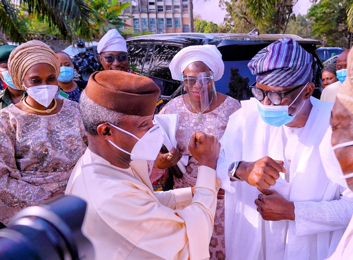 L-R:  Lagos State Governor, Mr. Babajide Sanwo-Olu (right), exchanging pleasantries with Vice President, Prof. Yemi Osinbajo while his wife, Dolapo (left) and others watch with admiration during the funeral service of Mrs Olubunmi Oyediran (first daughter of late Chief Obafemi Awolowo), at All Saints Church, Jericho, Ibadan, on Friday, December 4, 2020.