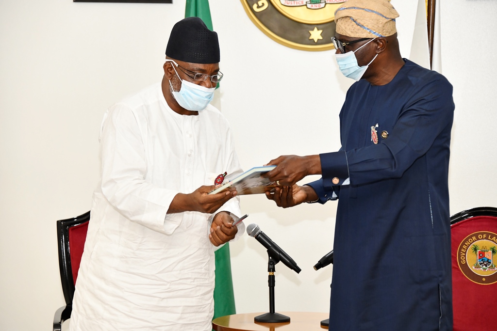 Chairman/CEO, National Hajj Commission of Nigeria (NAHCON), Alhaji Zikrullah Kunle Hassan (left) being presented with a souvenir by the Lagos State Governor, Mr. Babajide Sanwo-Olu during his courtesy visit at Lagos House, Marina, on Tuesday, December 1, 2020.