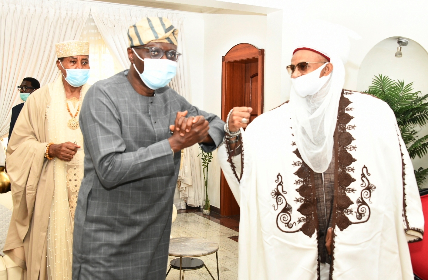 Lagos State Governor, Mr. Babajide Sanwo-Olu (left) exchanging greetings with Etsu Nupe, Alhaji Yahaya Abubakar (right) during a solidarity visit by the National Council of Traditional Rulers of Nigeria, at Lagos House, Marina, on Wednesday, December 2, 2020. Behind is Olugbo of Ugbo, Oba Fredrick Obateru Akinruntan.