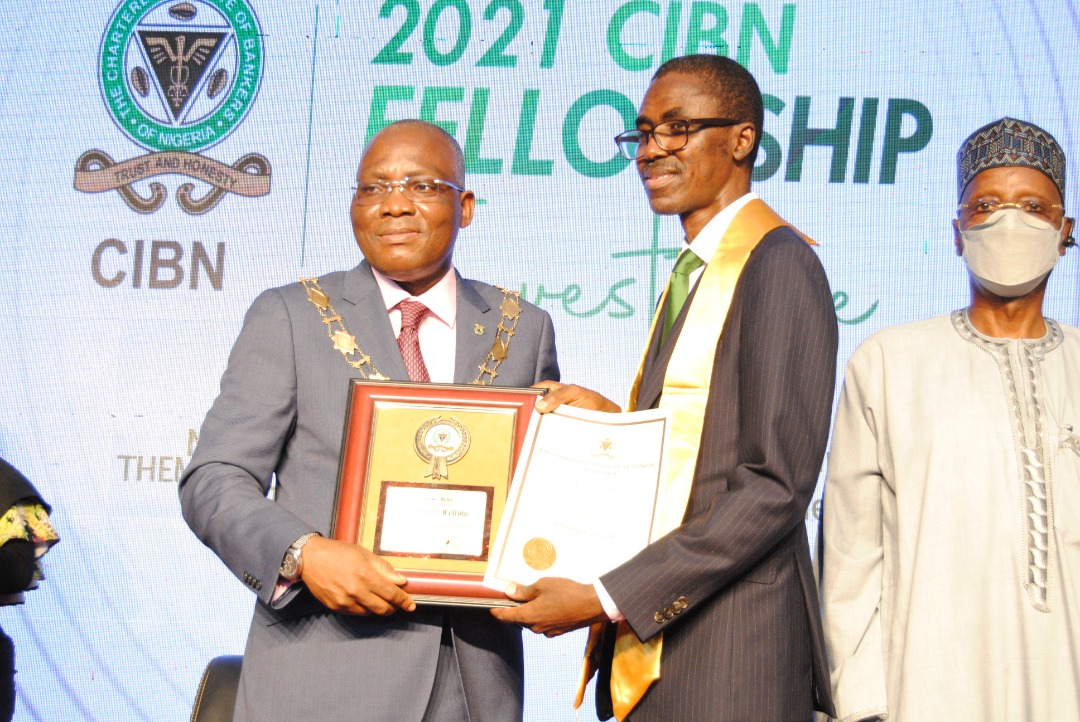 Photo: MD/CE, NDIC, Mr Bello Hassan (middle) Receiving His Certificate Of Honorary Fellowship Of CIBN